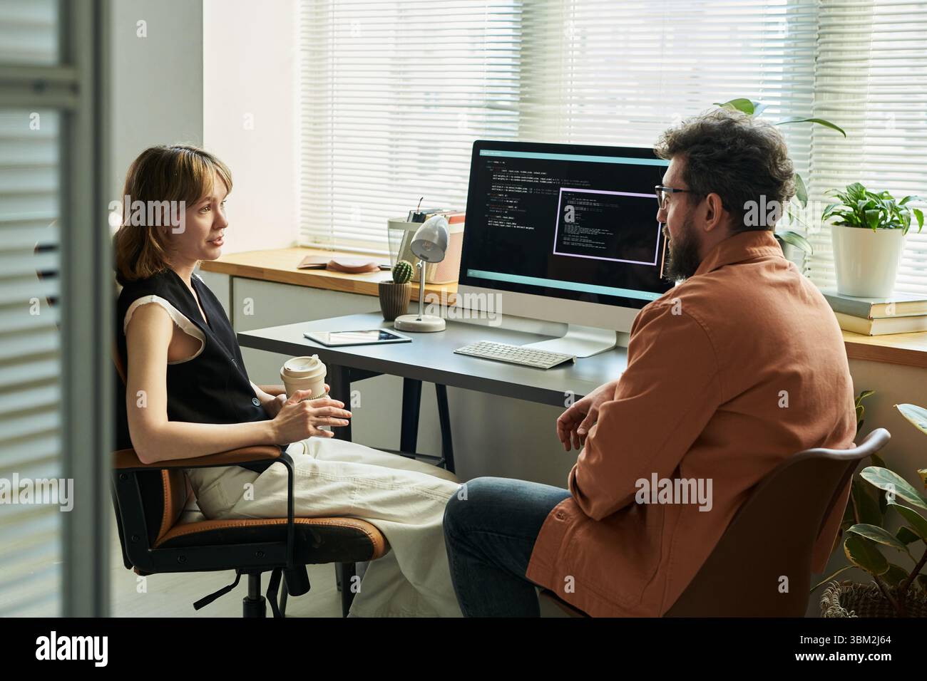 Colleagues Discussing Neural Network Development Stock Photo