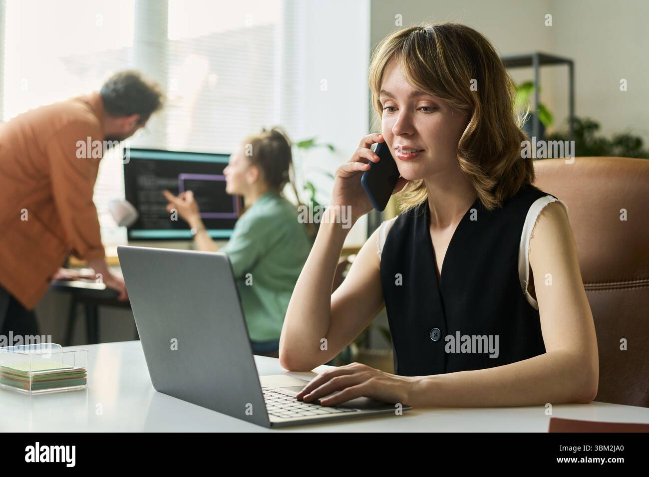 Young Caucasian Woman Developing Neural Network While Talking on Smartphone Stock Photo