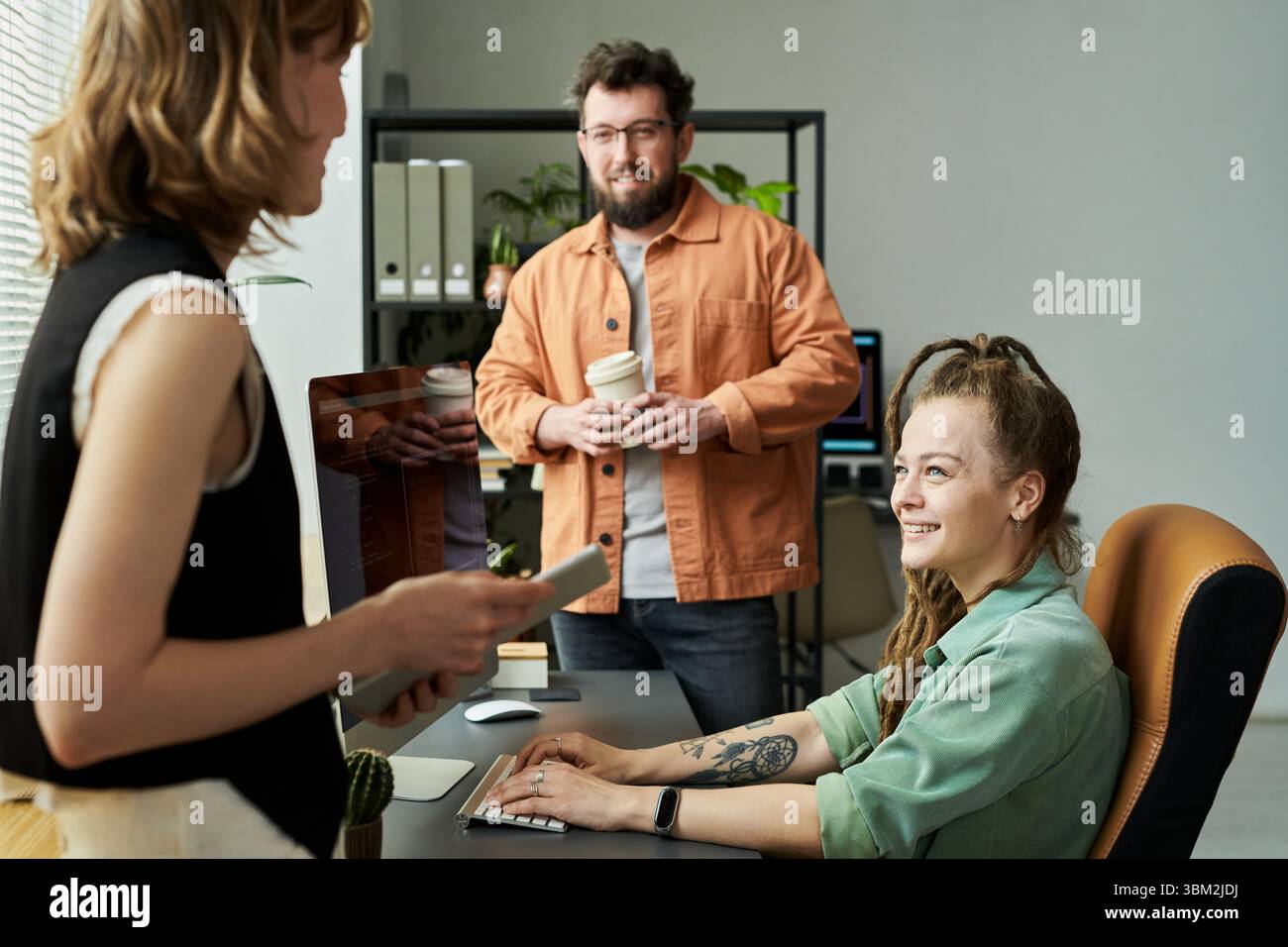 Woman Collaborating with Colleagues on Neural Network Development Stock Photo