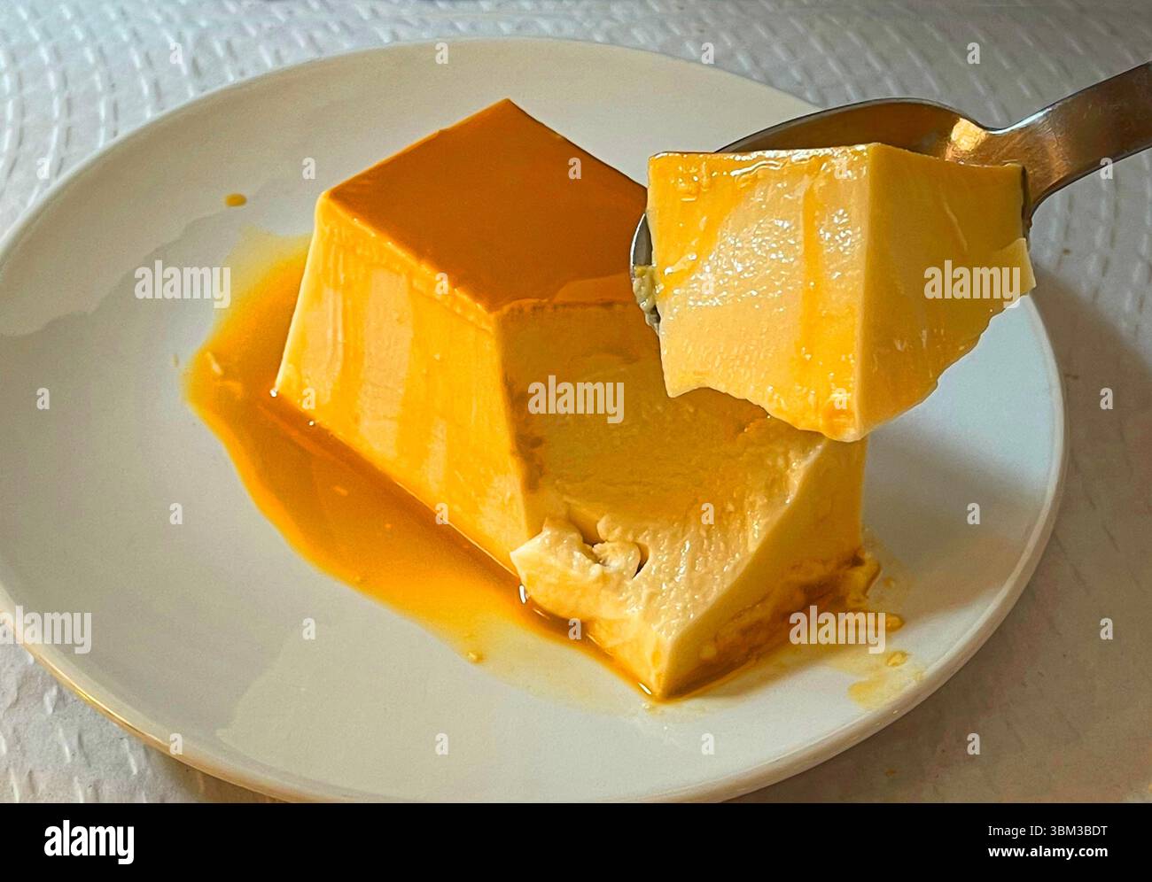 Eating cheese creme caramel. - Smartphone Captured Stock Image