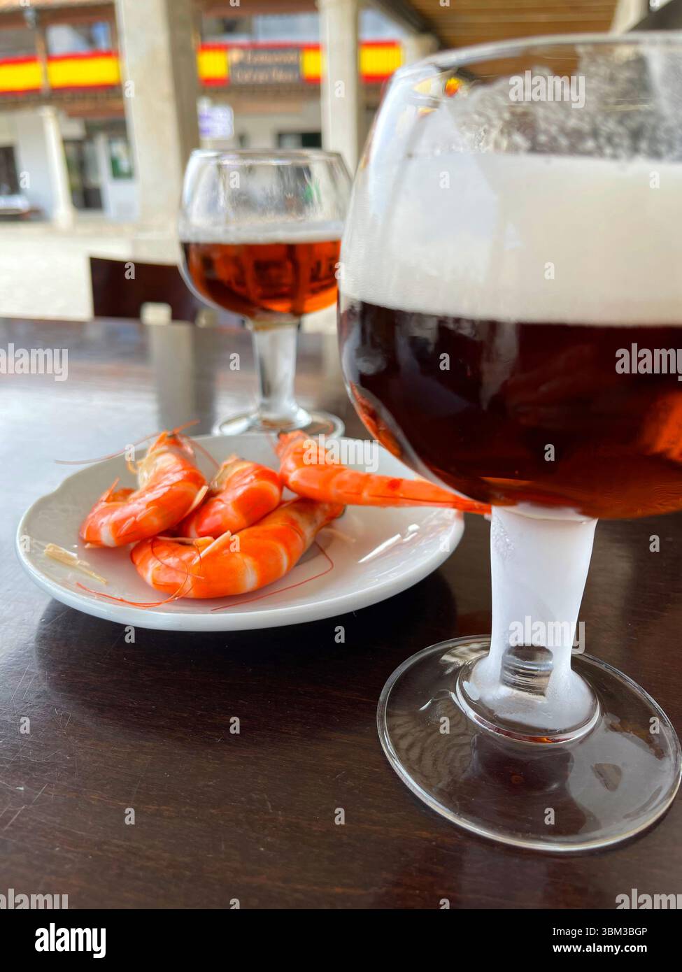 Two glasses of beer with prawns in a terrace. Spain. - Smartphone Captured Stock Image