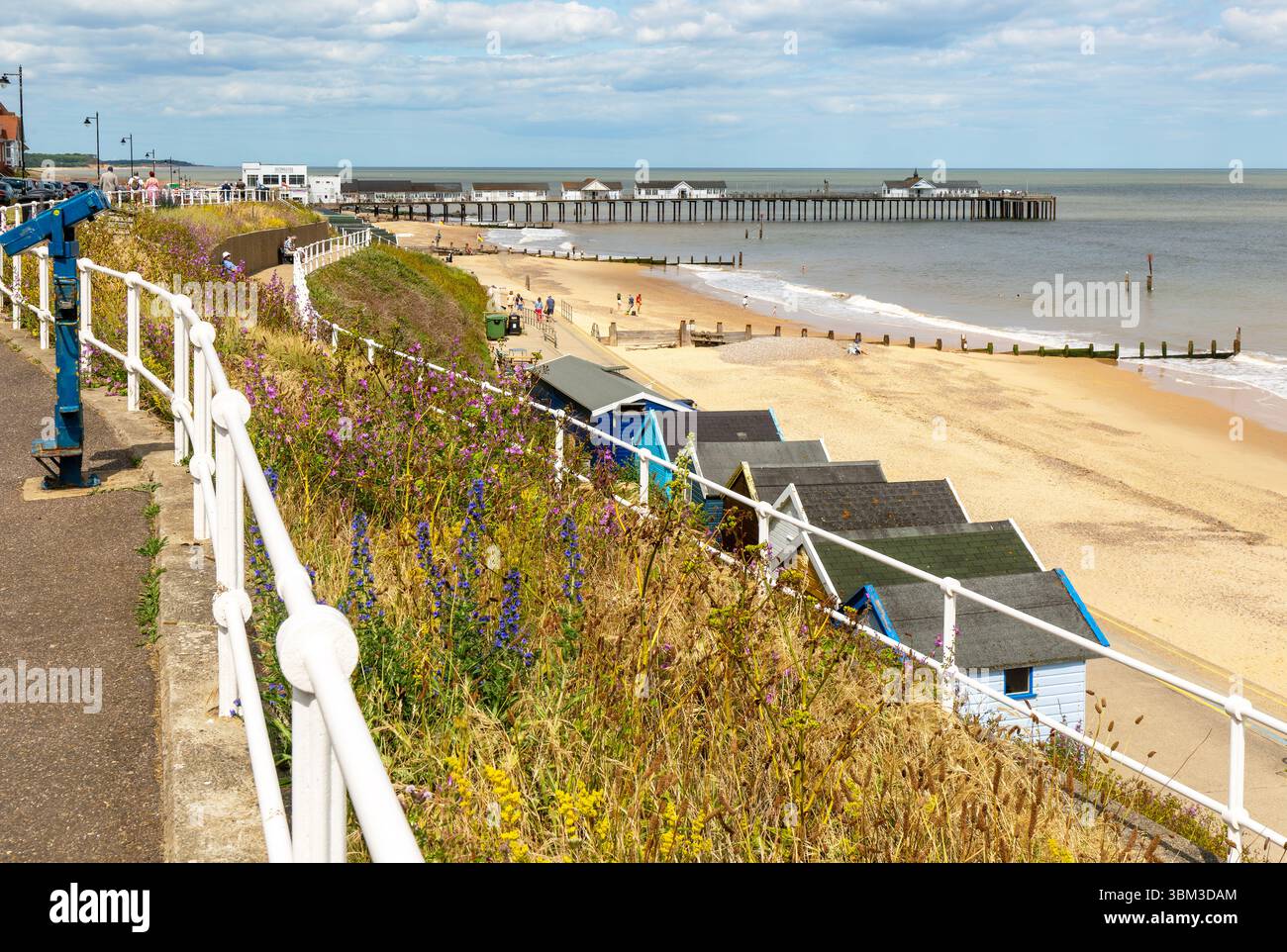View over beach huts to sandy beach and pier, Southwold, Suffolk, England, UK Stock Photo