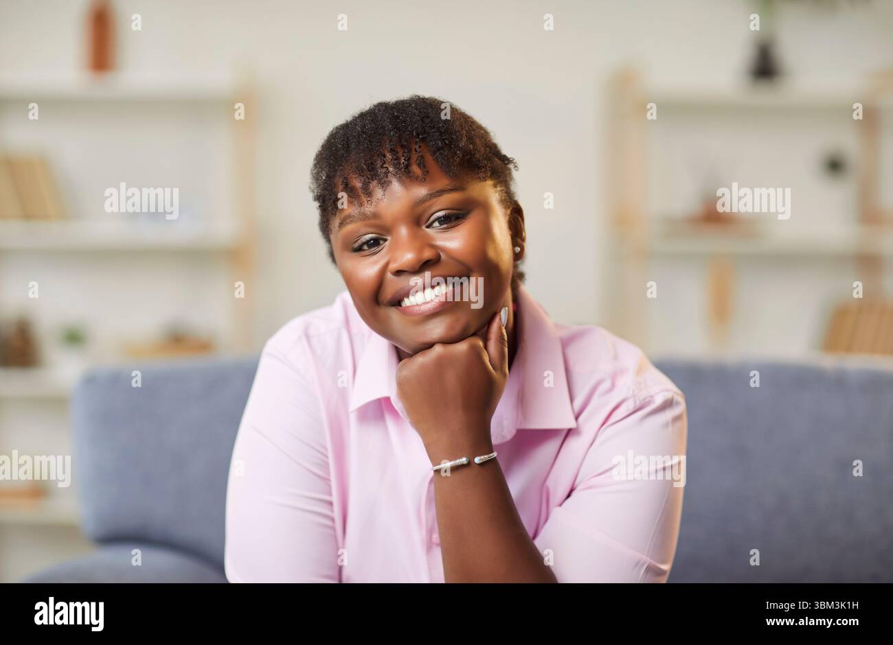 Happy smiling attractive middle aged african american woman looking at camera Stock Photo