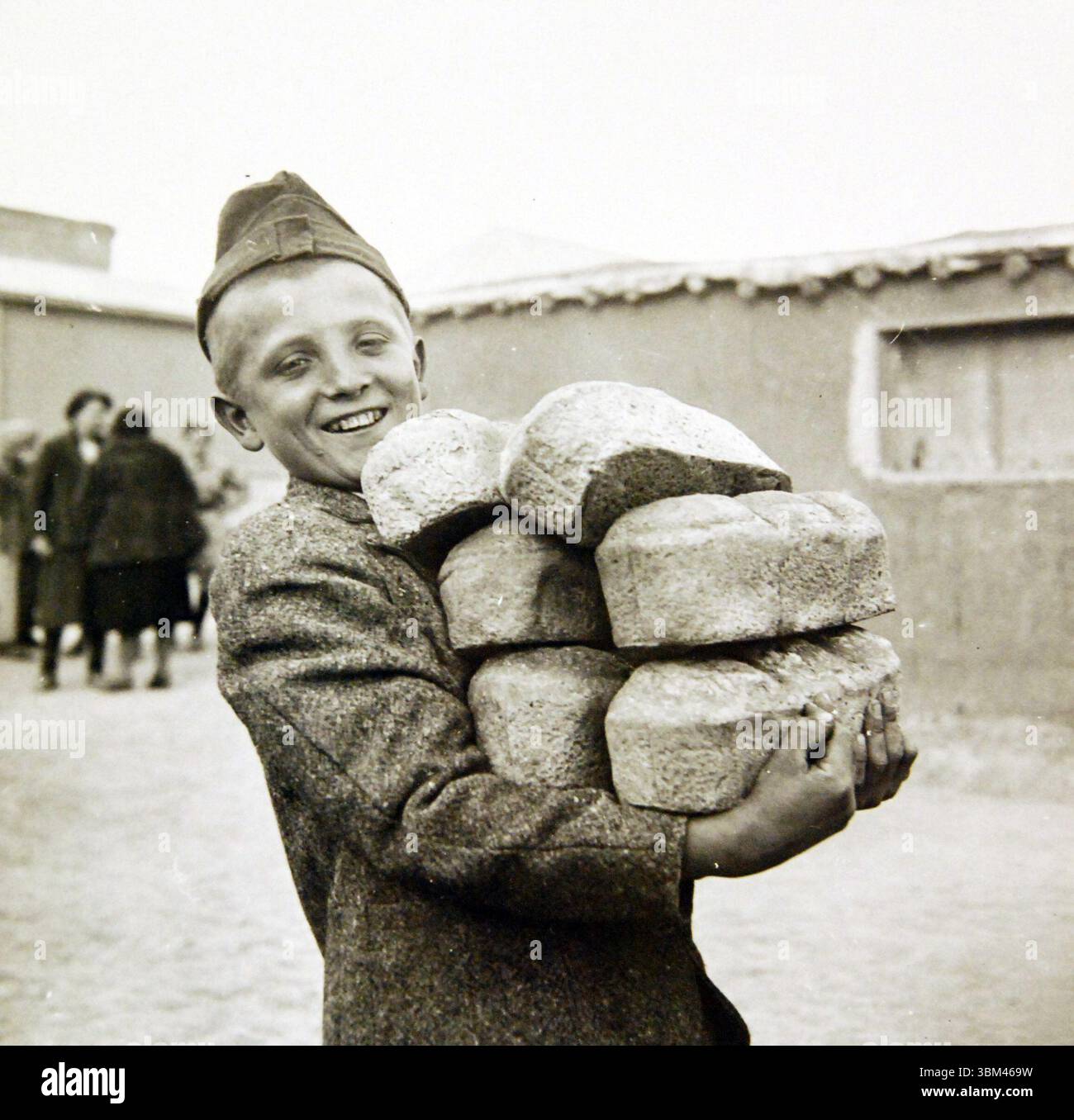 Teheran, Iran, March 1943. Polish youngster carrying an armload of ...
