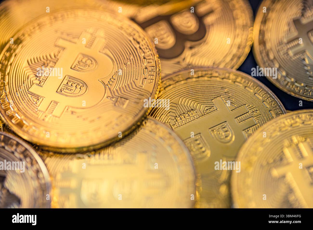 Abstract closeup of Bitcoin gold coins, soft light reflections, cryptocurrency concept, digital finance background, financial investment technology Stock Photo