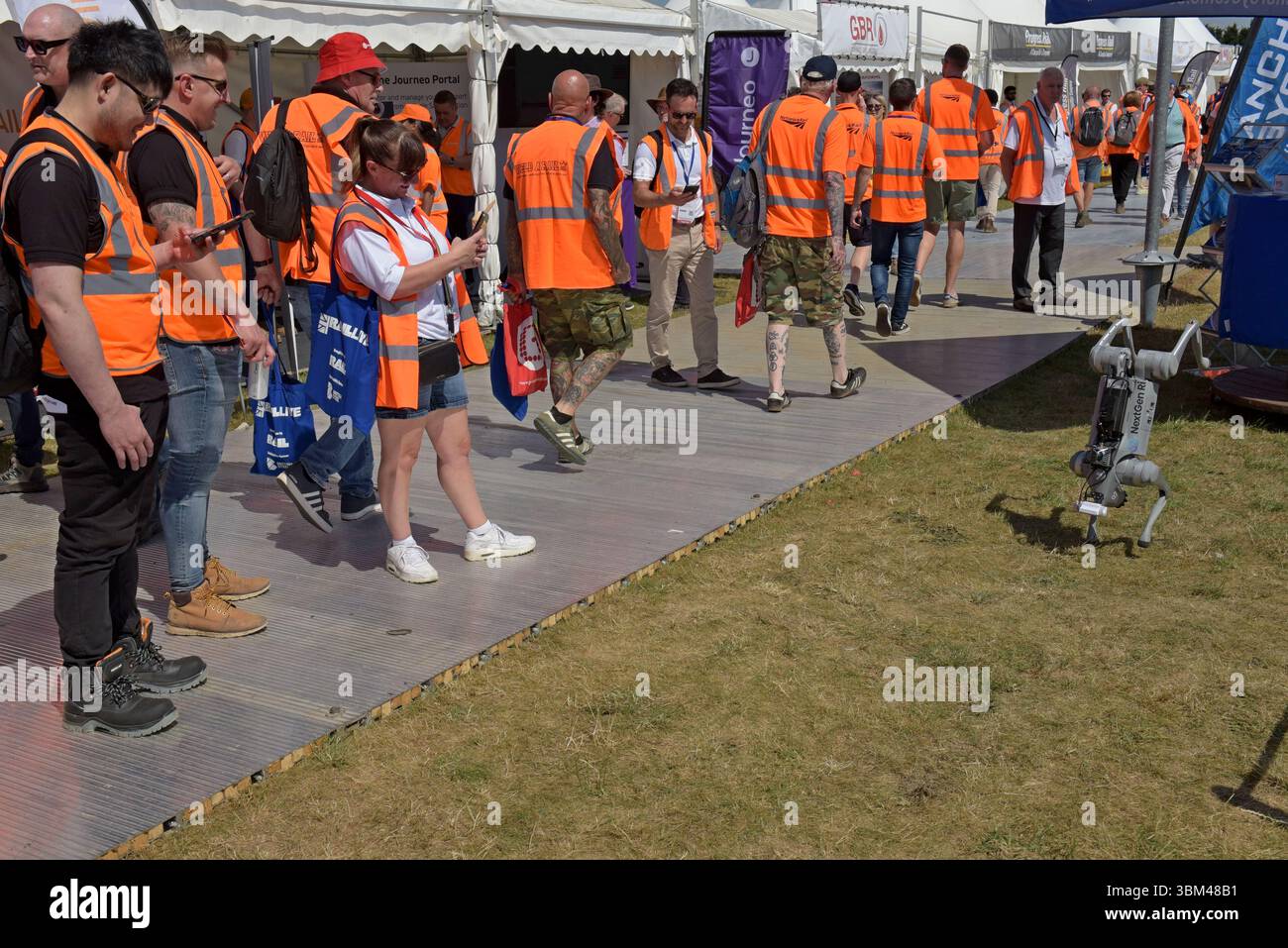 People photographing a Belvoir Rail robot dog, or Quadruped robot, survey tool, at Rail Live railway industry event, 18th June 2025 Stock Photo