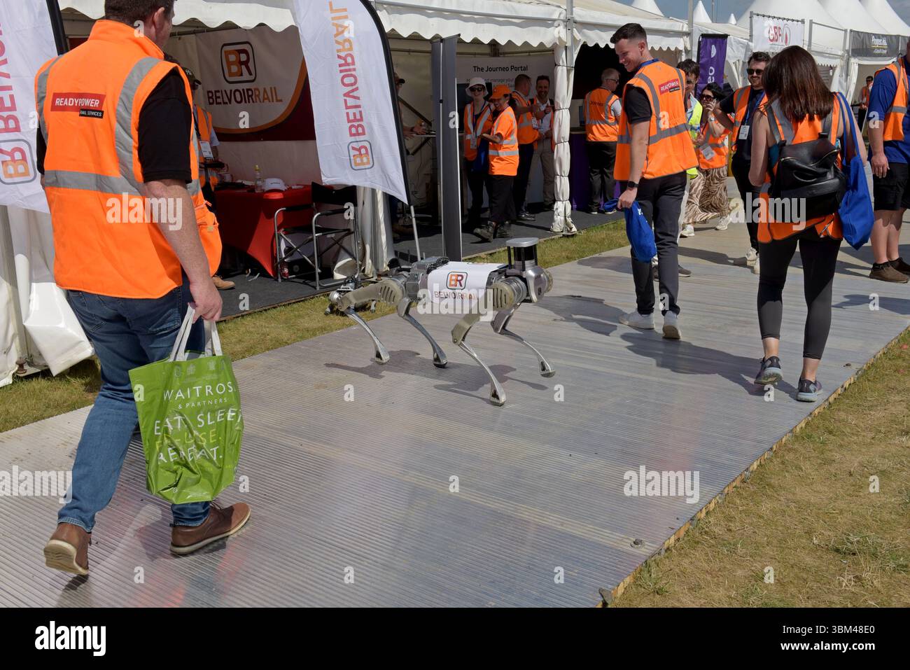 People photographing a Belvoir Rail robot dog, or Quadruped robot, survey tool, at Rail Live railway industry event, 18th June 2025 Stock Photo