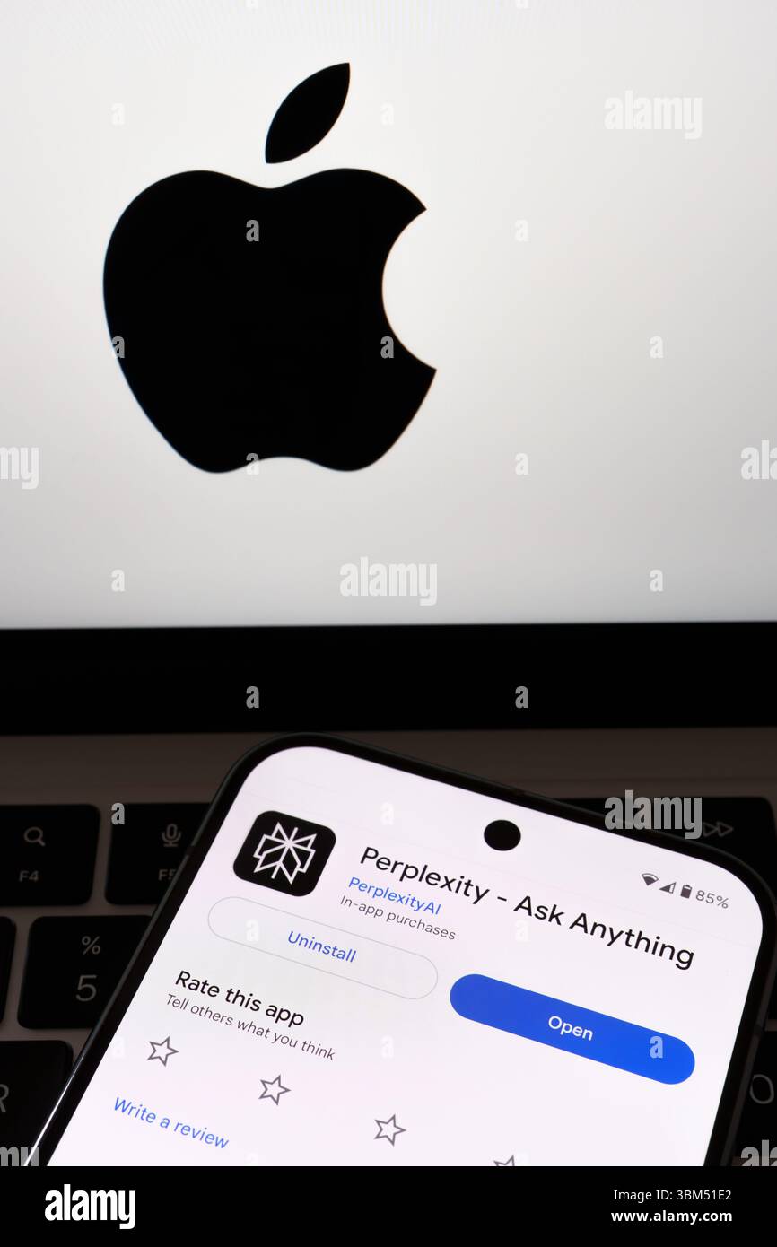 Perplexity AI open screen on smartphone positioned in front of Apple ...