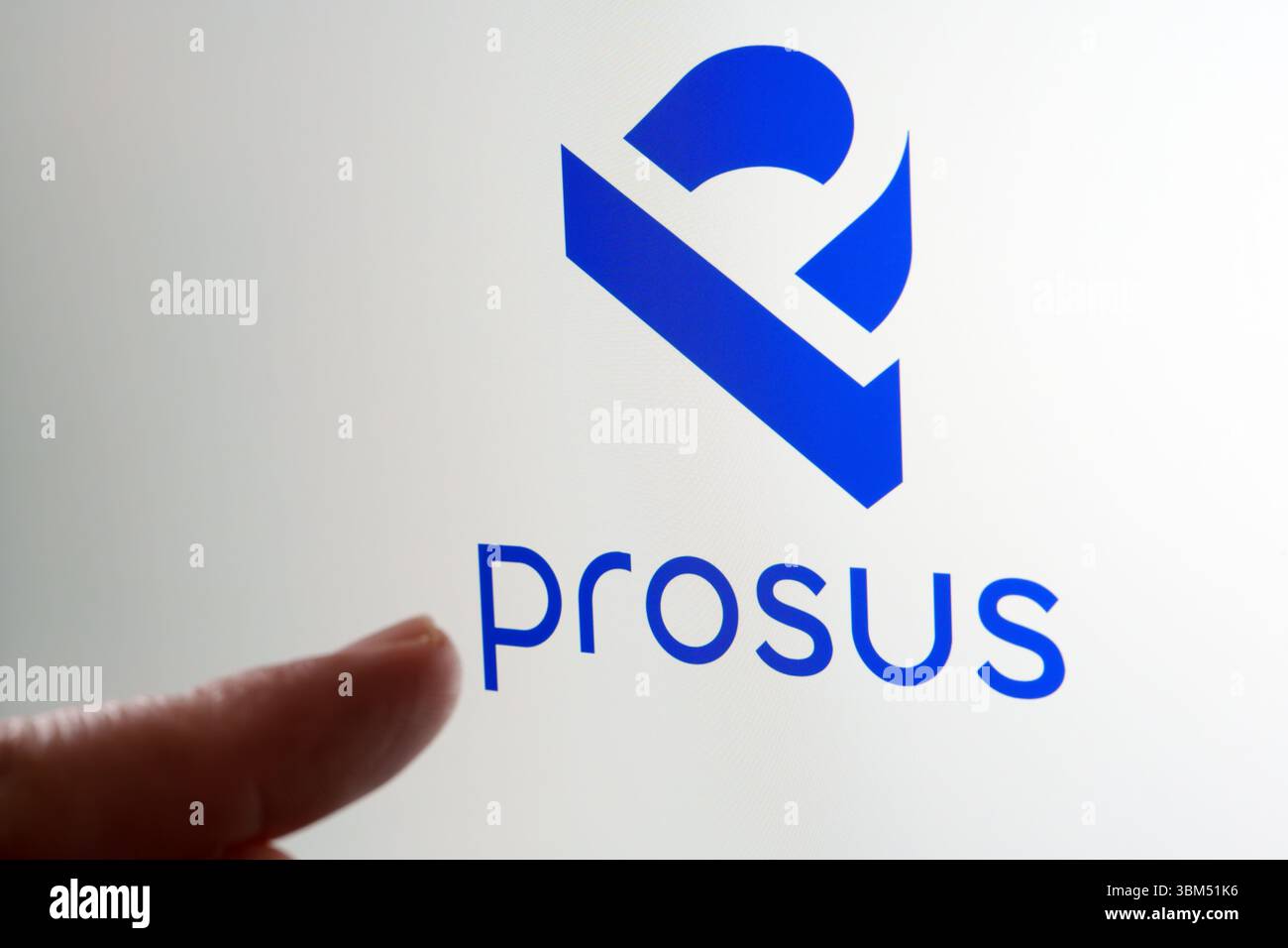 Prosus brand logo shown on screen with fingertip pointing toward blue symbol. Stafford, United Kingdom, June 24, 2025 Stock Photo