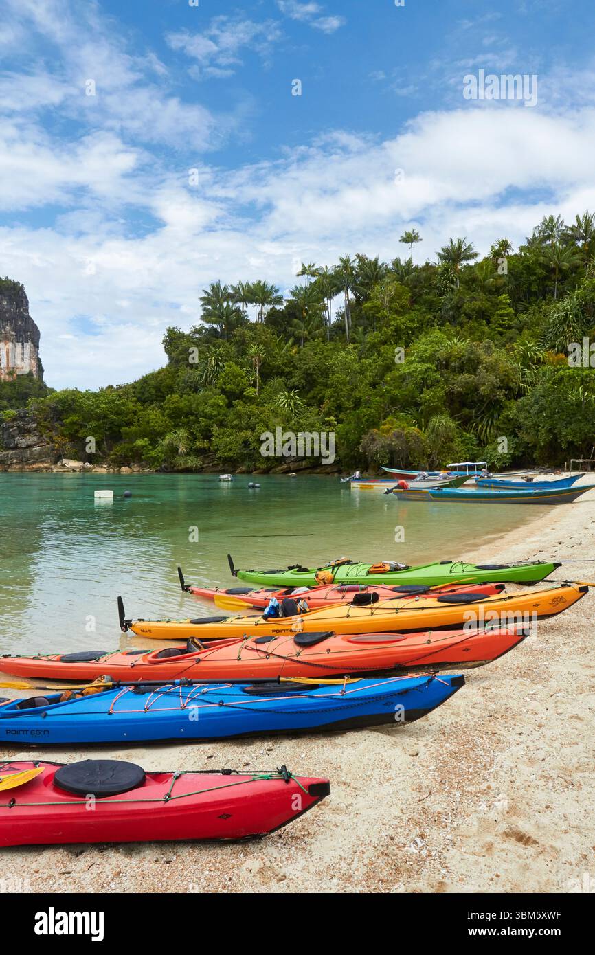 Kayaks, outer archipelago, Misool, Raja Ampat, Southwest Papua, Indonesia Stock Photo