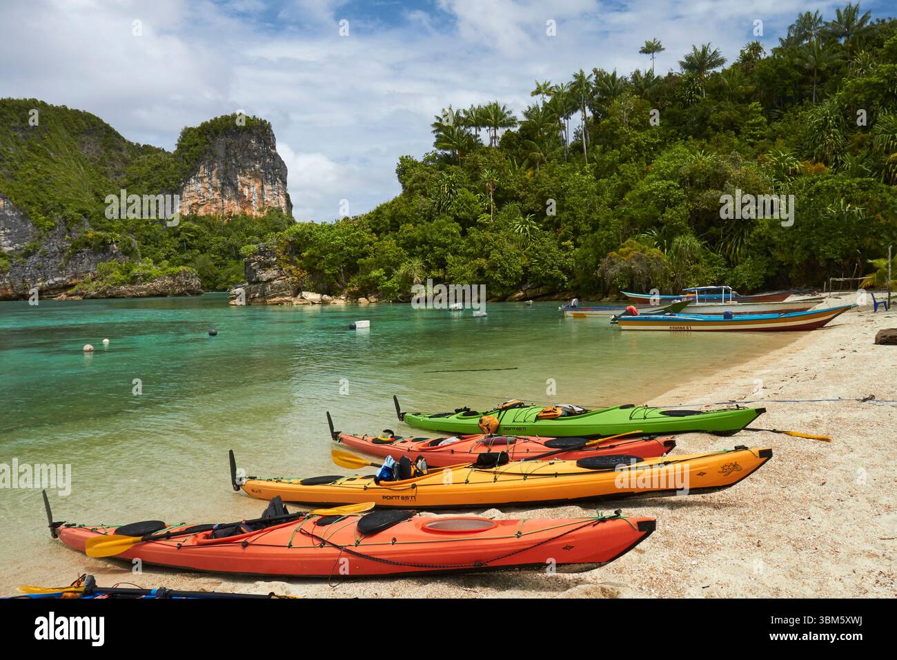 Kayaks, outer archipelago, Misool, Raja Ampat, Southwest Papua, Indonesia Stock Photo