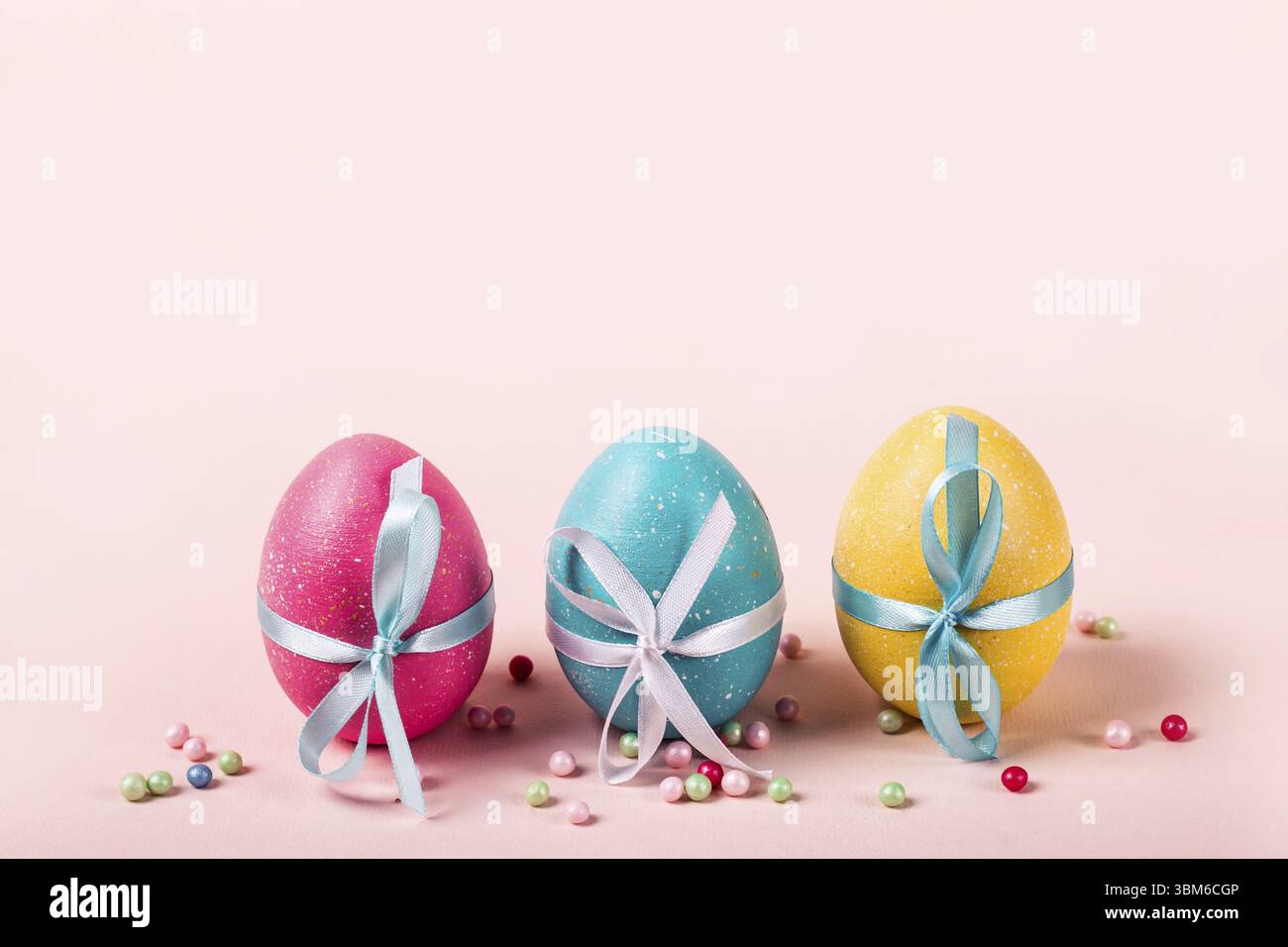 Three decorated eggs are in a row. Easter concept Stock Photo