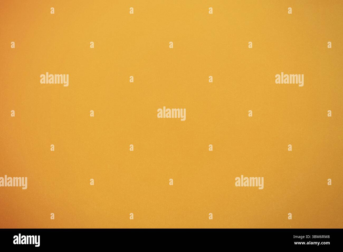 Flat design is displaying smooth orange backdrop featuring faint specks and subtle gradients Stock Photo