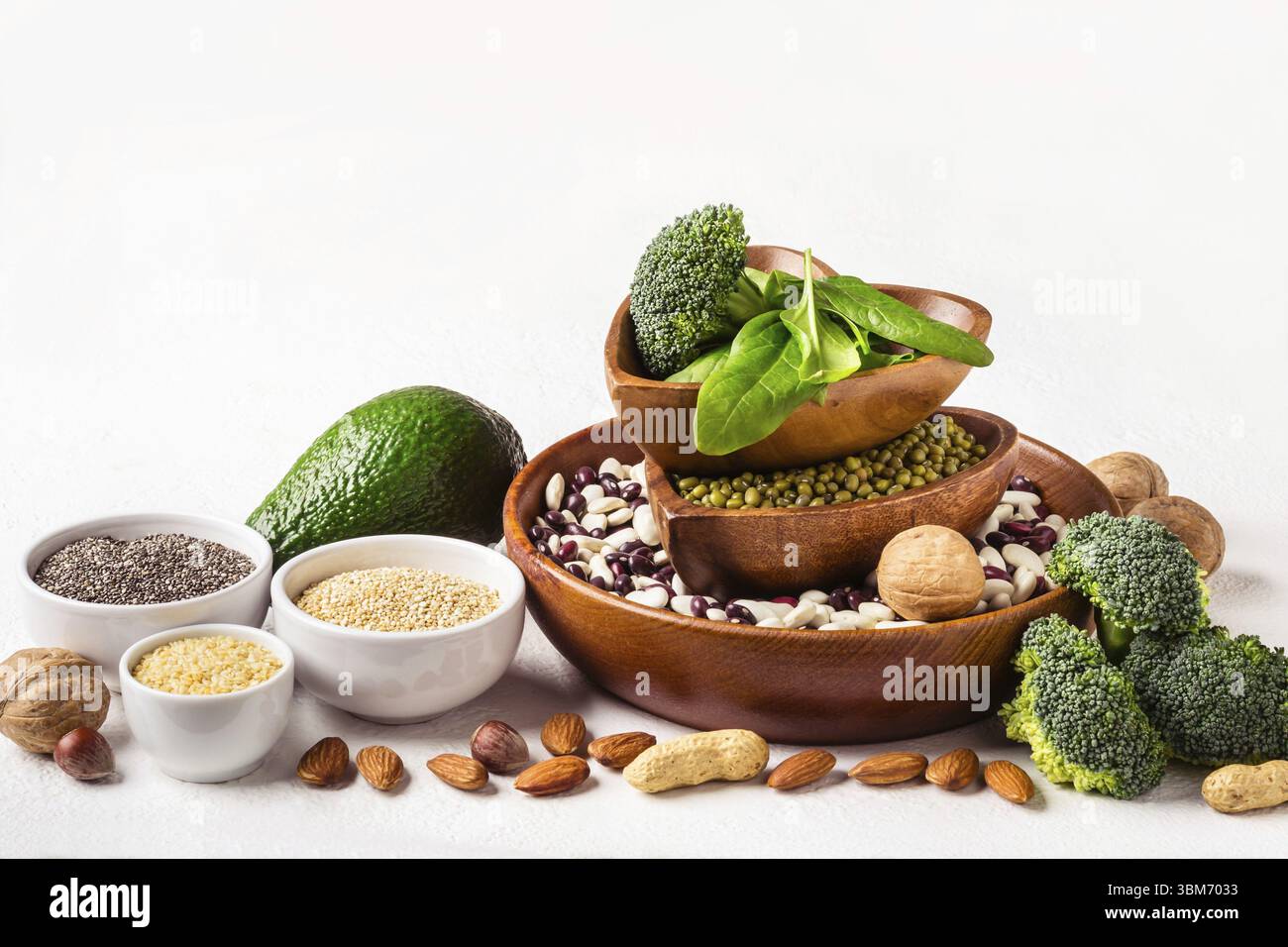 Vegetable Sources Diverse Sources of vegetable protein. Nuts, beans and broccoli on white ...