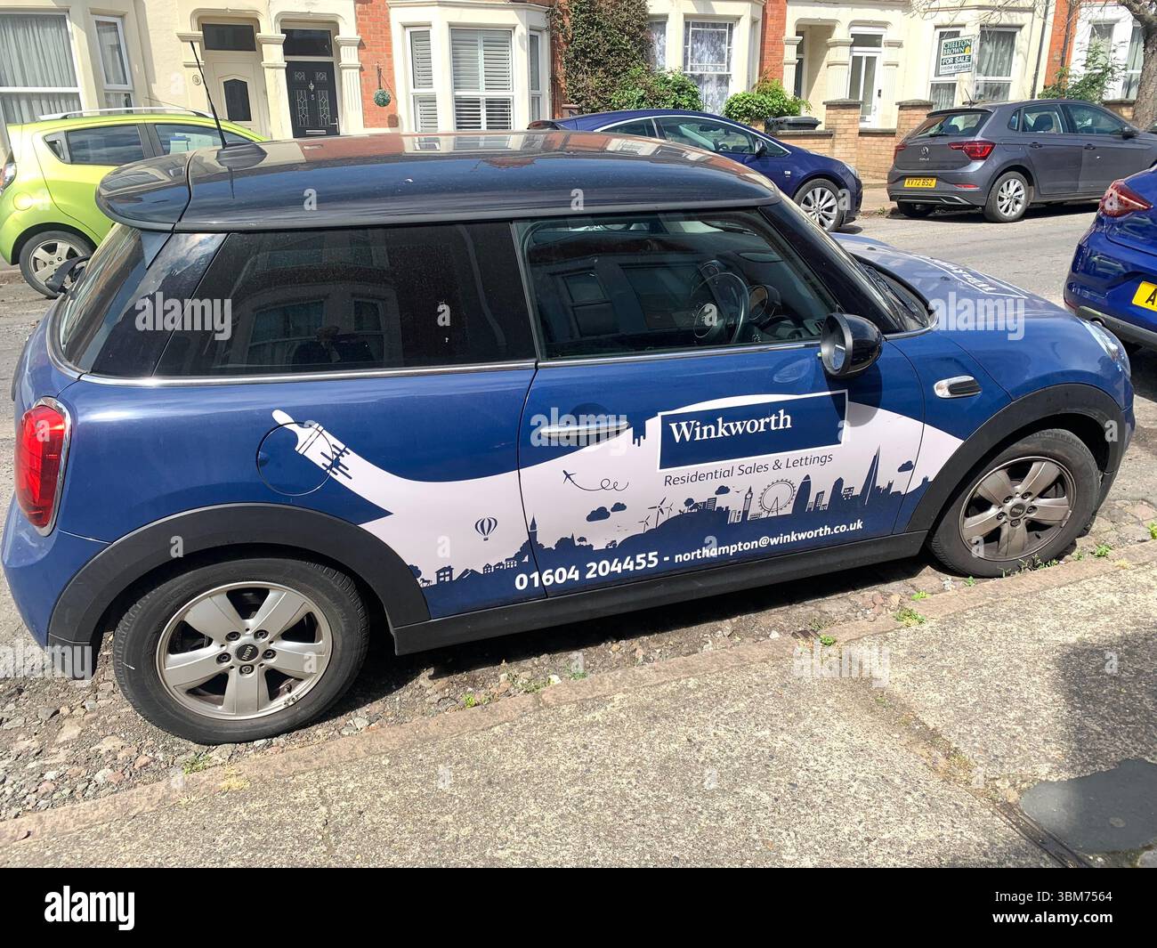 min car British sporty looking vehicle sell buy houses Winkworth James Anthony letting company parked Northampton Adams Avenue local lettings - Smartphone Captured Stock Image