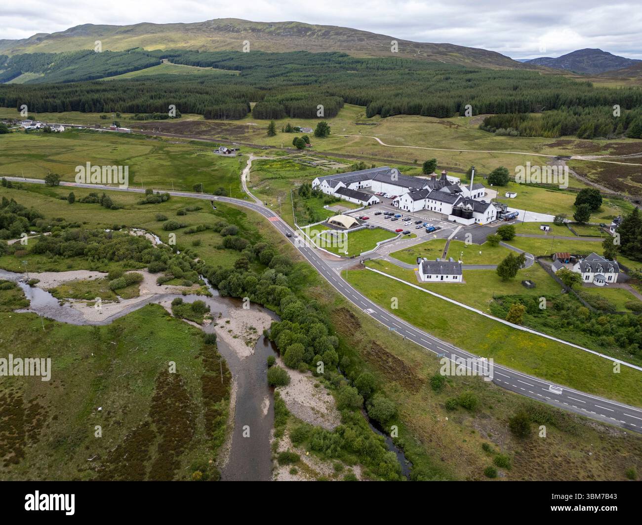 Aerial drone view of Dalwhinnie Distillery beside the river Truim, Highland region, Scotland Stock Photo