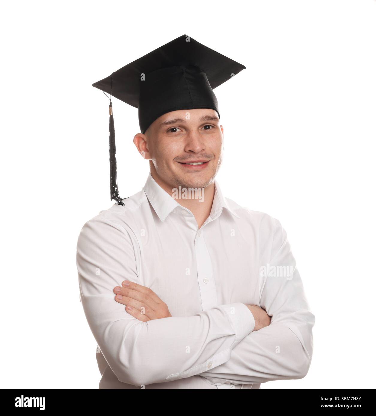 Happy student with crossed arms after graduation on white background ...