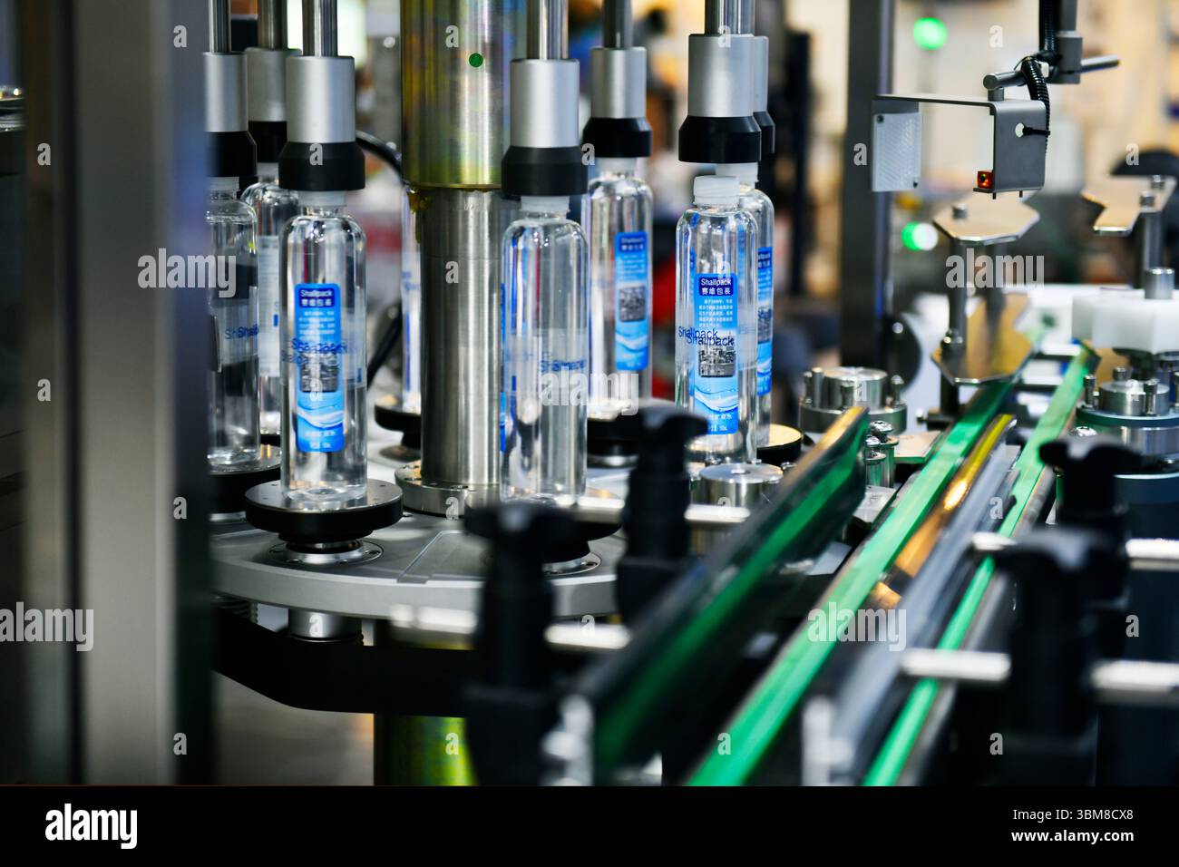 Bangkok, Thailand-June13,2025: Plastic bottles in a conveyor belt on a high quality automatic vertical filling machine in Propak asia at Bitec Exhibit Stock Photo