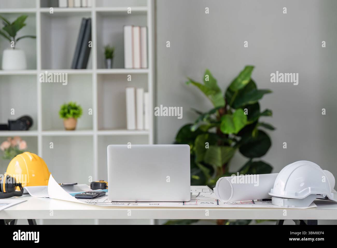 Workspace and Project Organization. An organized architectural workspace featuring tools and equipment for construction projects. Stock Photo