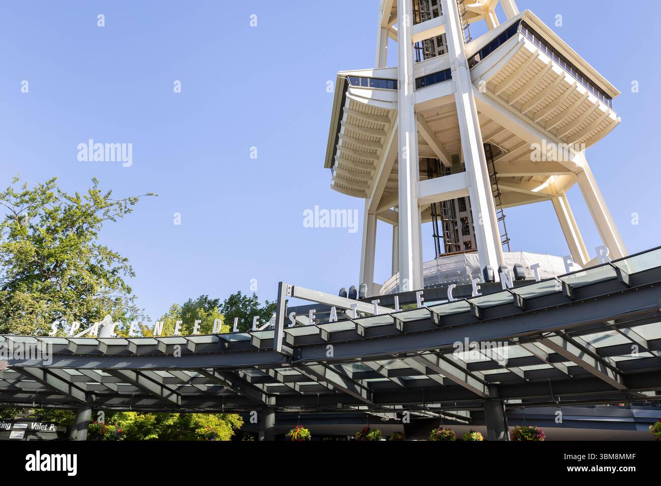 The Space Needle, located in the Lower Queen Anne neighborhood, is the most famous landmark in Seattle that offers amazing views of the entire city. Stock Photo