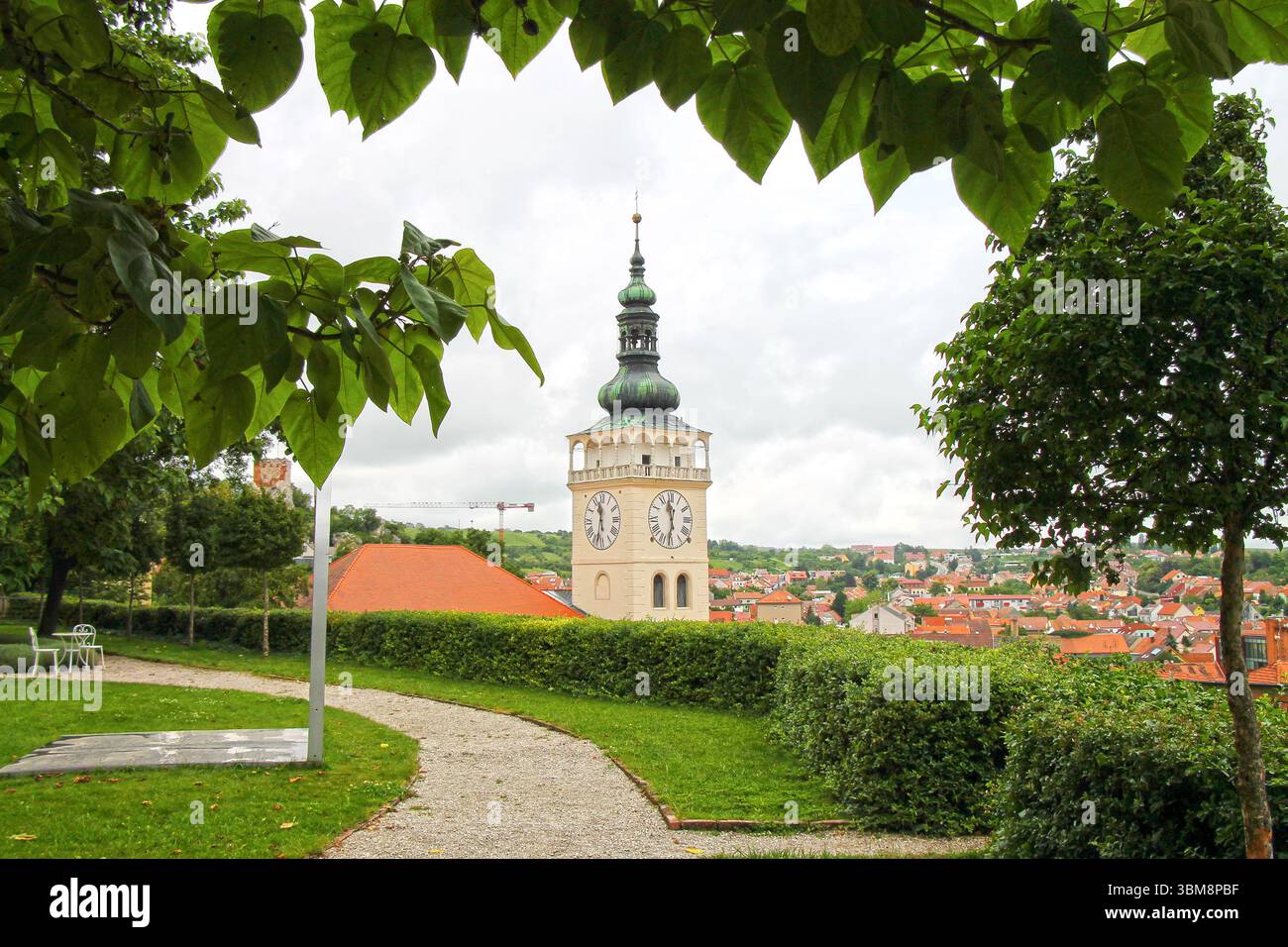 View of the castle clock tower from the garden. City of Mikulov in Czech Republic. Stock Photo