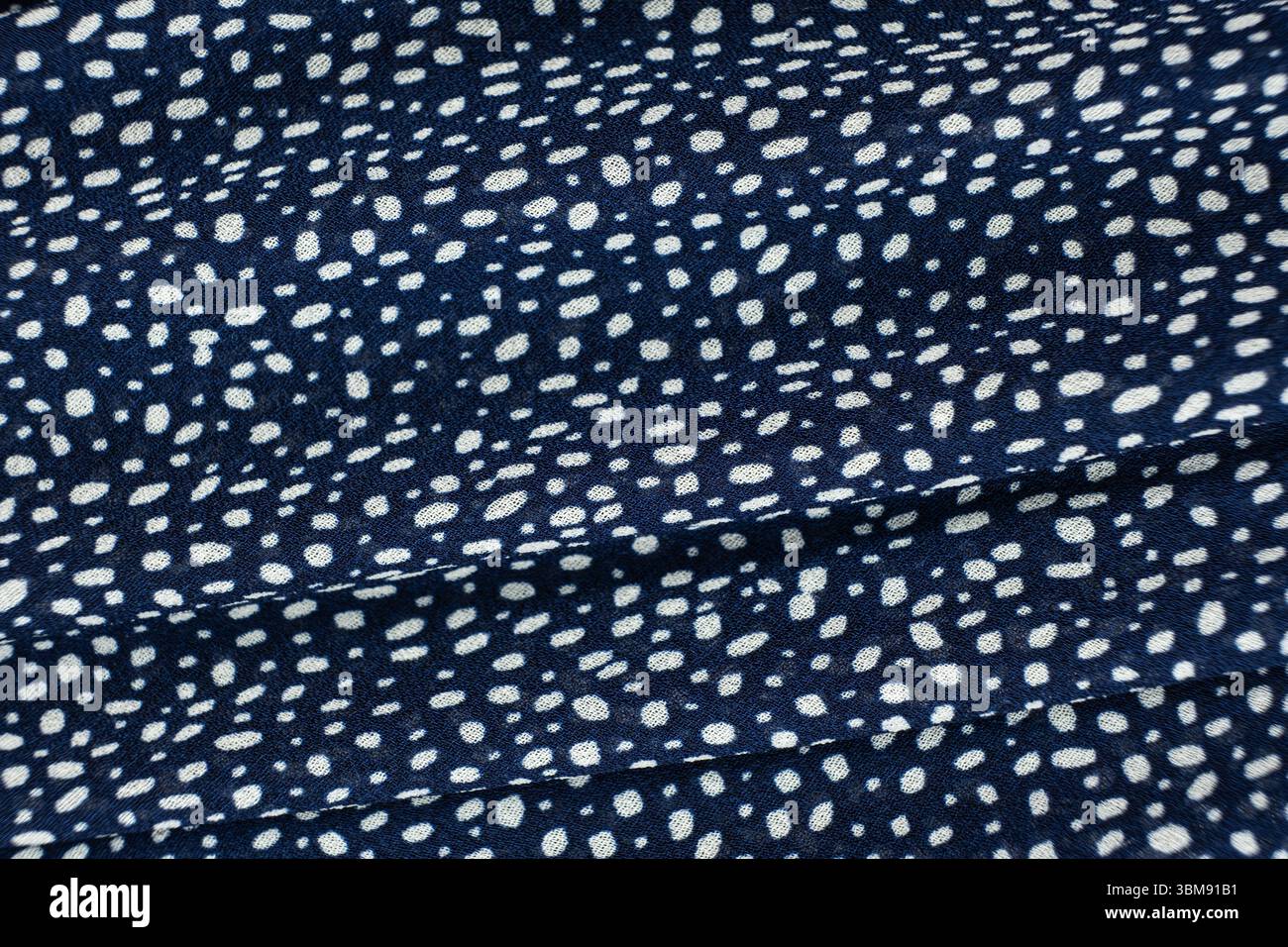 Macro Texture Polyester Blue Fabric Polka Dot Pattern. Stock Photo