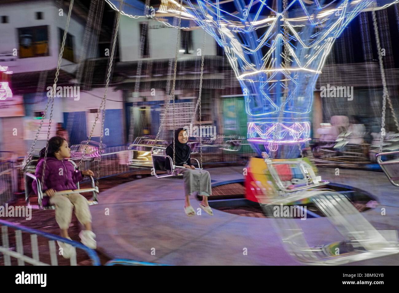 June 25, 2025, Garut, West Java, Indonesia: People enjoy the fun fair ...