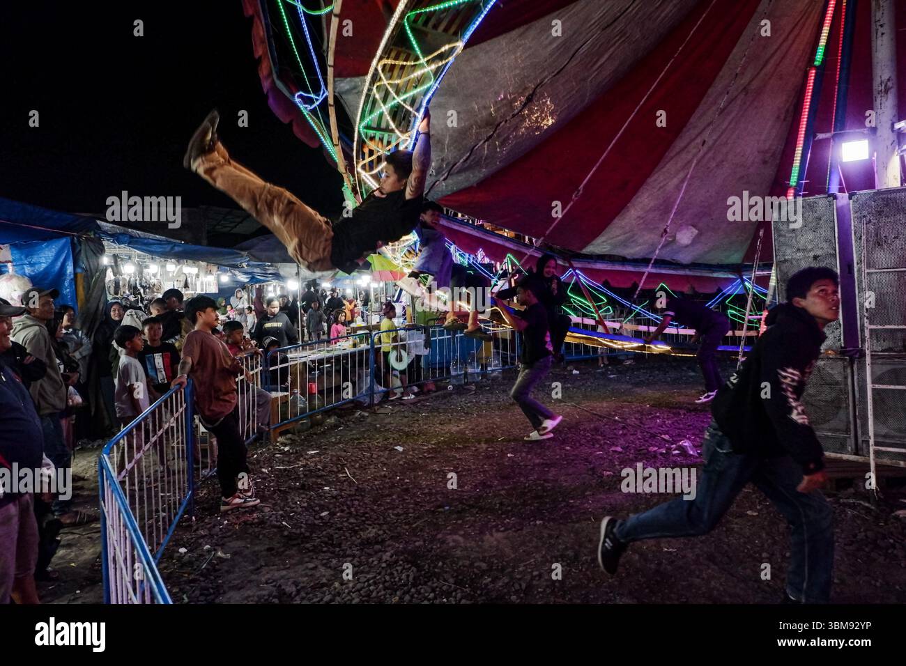 June 25, 2025, Garut, West Java, Indonesia: People enjoy the fun fair ...
