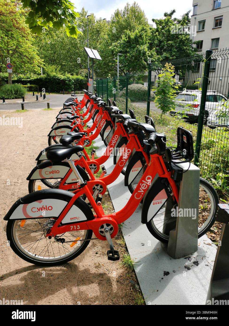 C velo bikes are lined up at a bike-sharing station in Clermont Ferrand, providing an eco-friendly transport option. Puy de Dome, Auvergne , France - Smartphone Captured Stock Image
