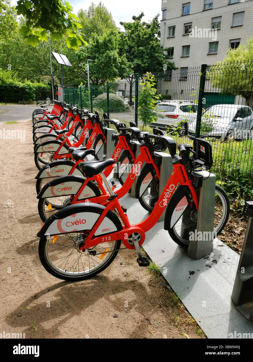 C velo bikes are lined up at a bike-sharing station in Clermont Ferrand, providing an eco-friendly transport option. Puy de Dome, Auvergne , France - Smartphone Captured Stock Image