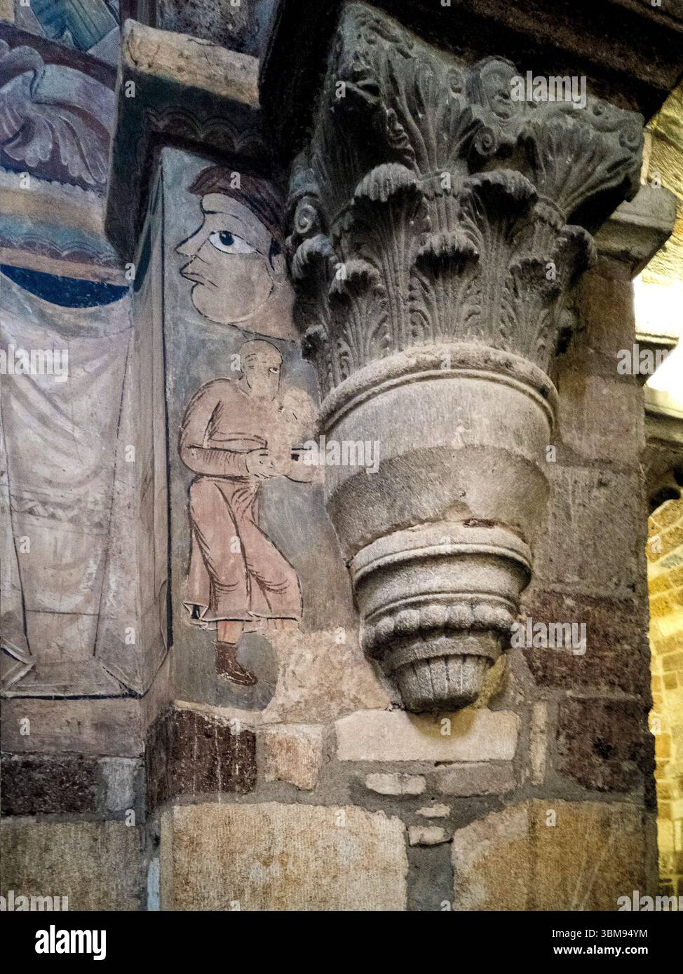 Frescoes adorn the pillars of Basilica Saint Julien in Brioude, revealing  biblical scenes and saints. Haute Loire. Auvergne Rhone Alpes. France - Smartphone Captured Stock Image