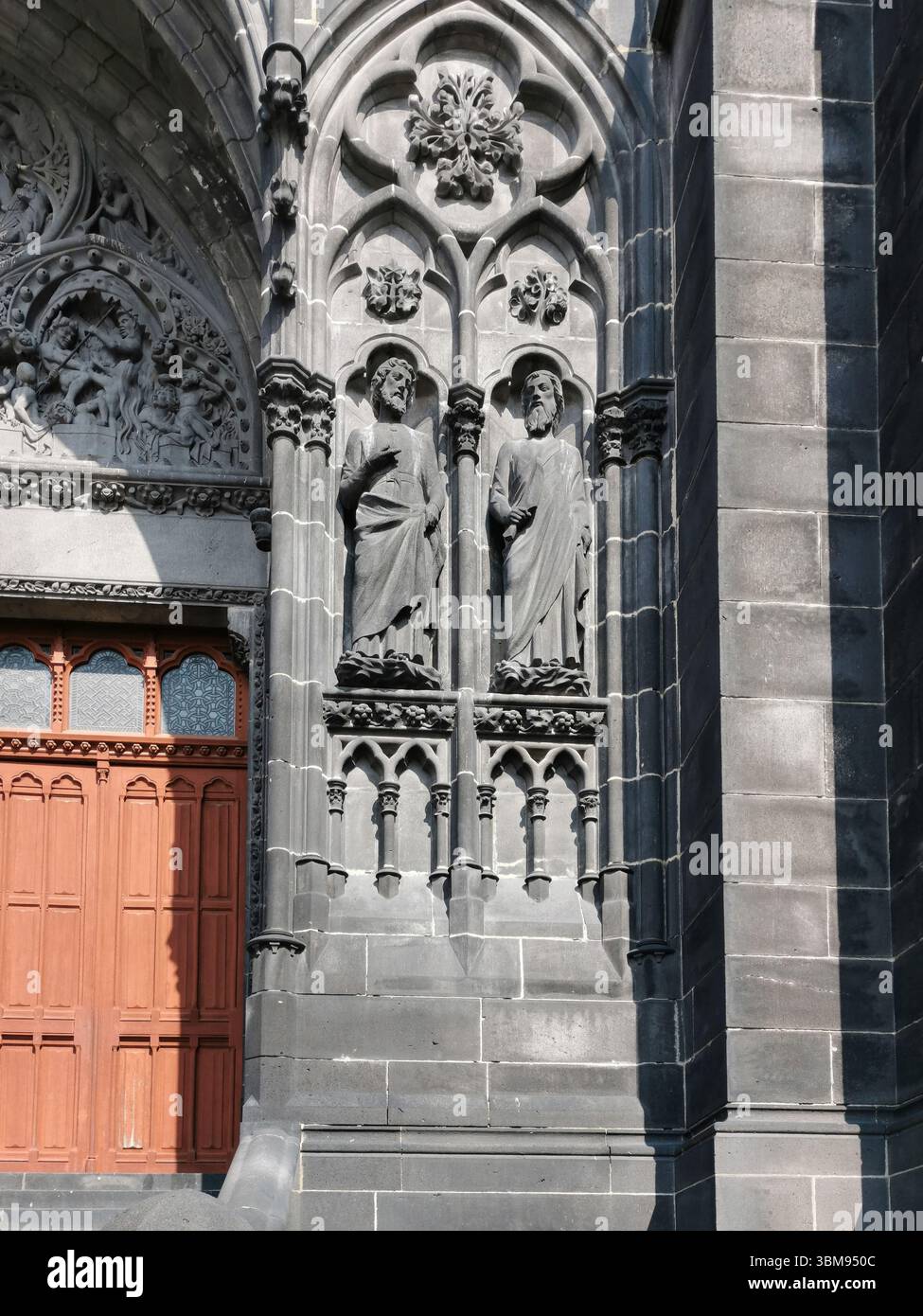 Intricately carved statues line the porch of the Cathedral of Notre-Dame-de-l'Assomption in Clermont-Ferrand. Puy de Dome. Auvergne Rhone Alpes.France - Smartphone Captured Stock Image