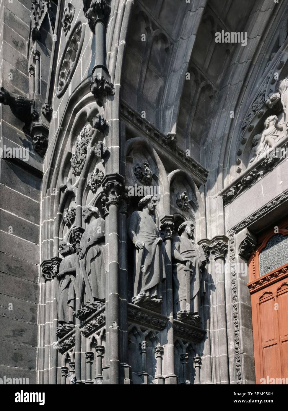 Intricately carved statues line the porch of the Cathedral of Notre-Dame-de-l'Assomption in Clermont-Ferrand. Puy de Dome. Auvergne Rhone Alpes.France - Smartphone Captured Stock Image