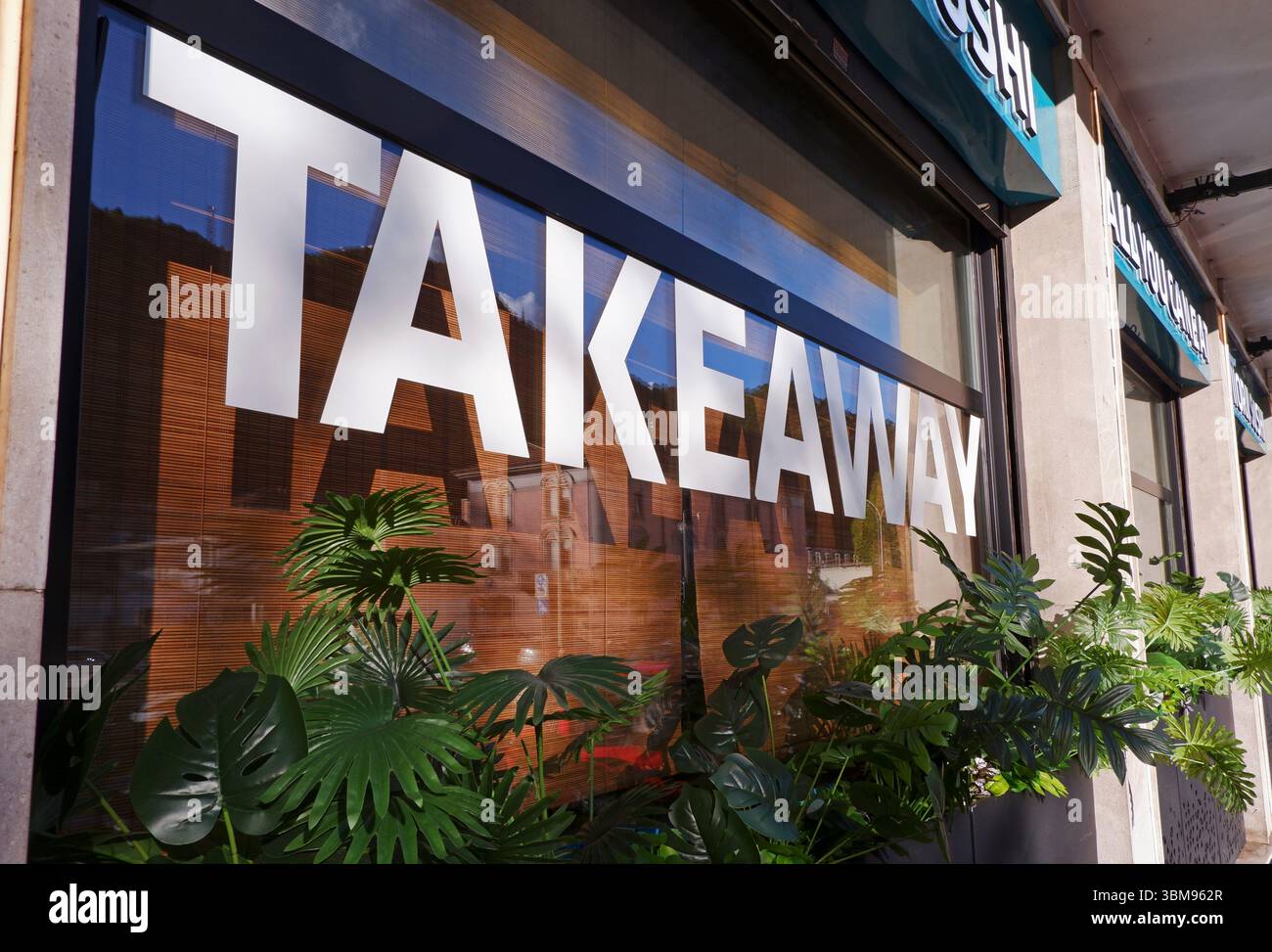 take away sign on sushi restaurant window Stock Photo