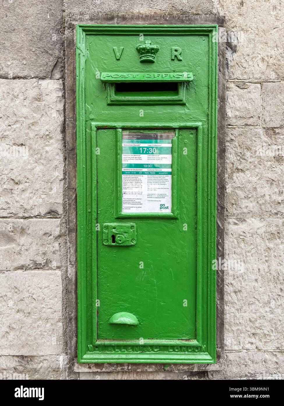 An iconic green wall-mounted post box from the Victorian era in Ireland ...