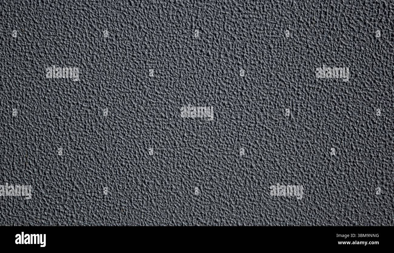 Dark gray textured background creating a repeating pattern, ideal for design projects Stock Photo