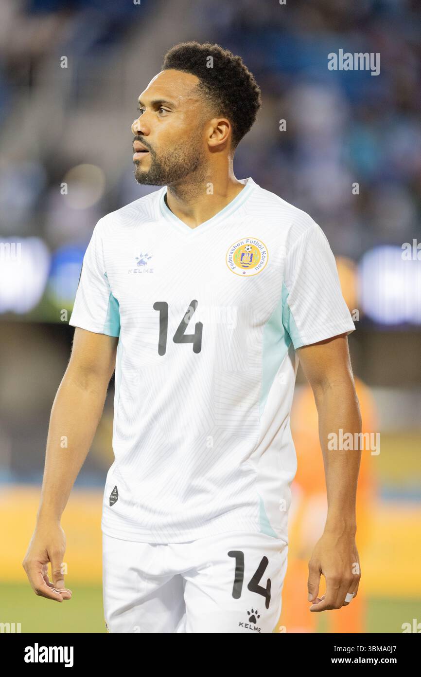 Seattle Mariners' Kenji Johjima looks at third base coach Carlos Garcia  during the first inning of an exhibition baseball game against the Tacoma  Rainiers at Cheney Field on Saturday, April 1, 2006,, image size:866x1390