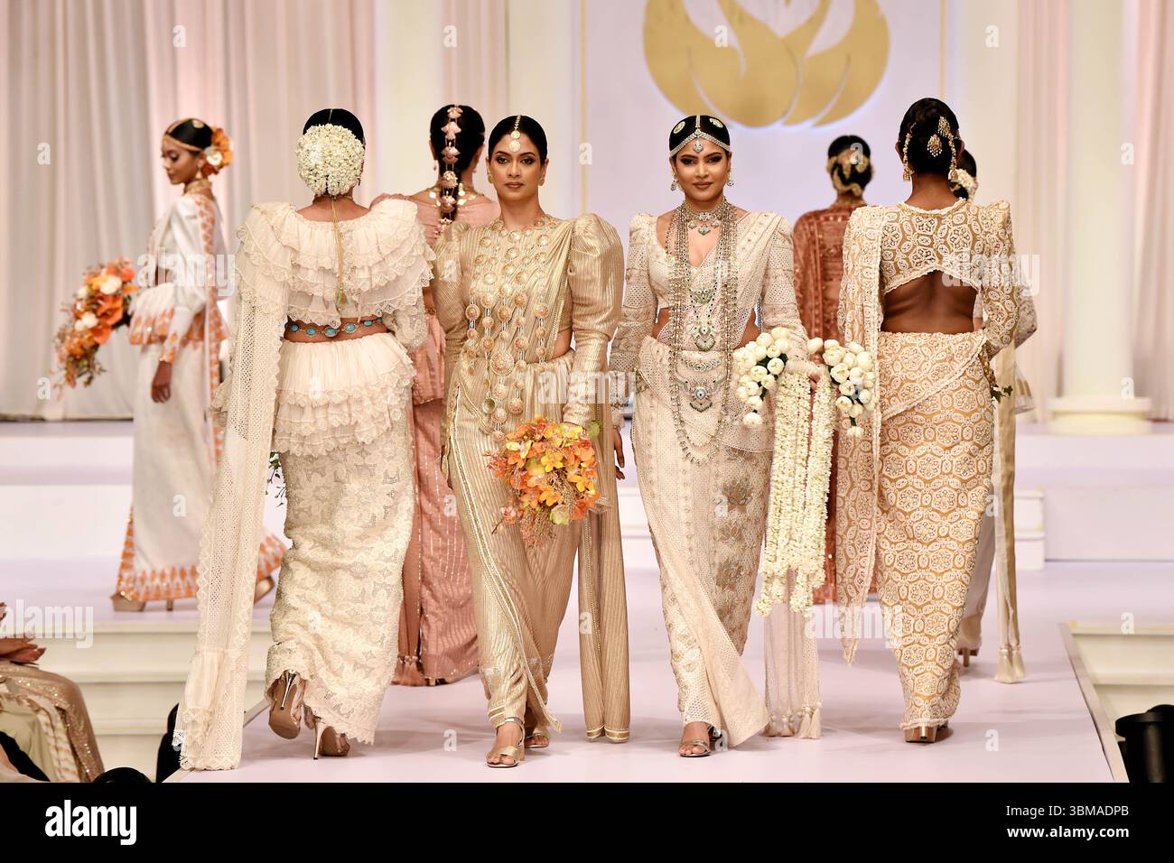 Colombo, Sri Lanka. 24th June, 2025. Models present creations during an ...
