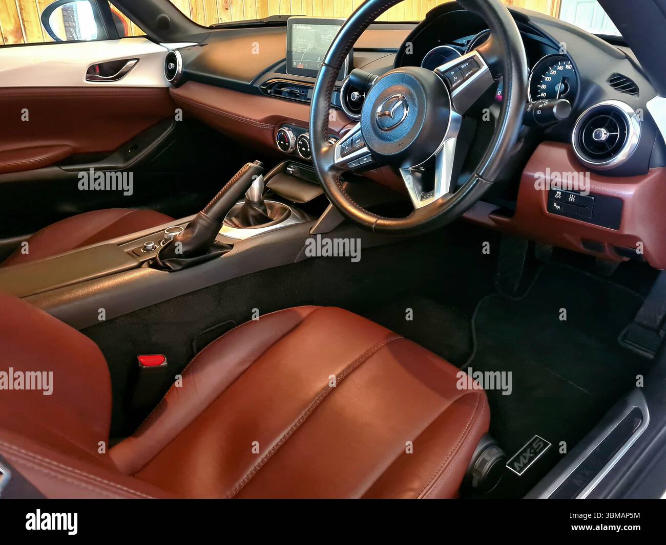 Luxury interior of Mazda MX5 coupe with terracotta napa leather Stock Photo