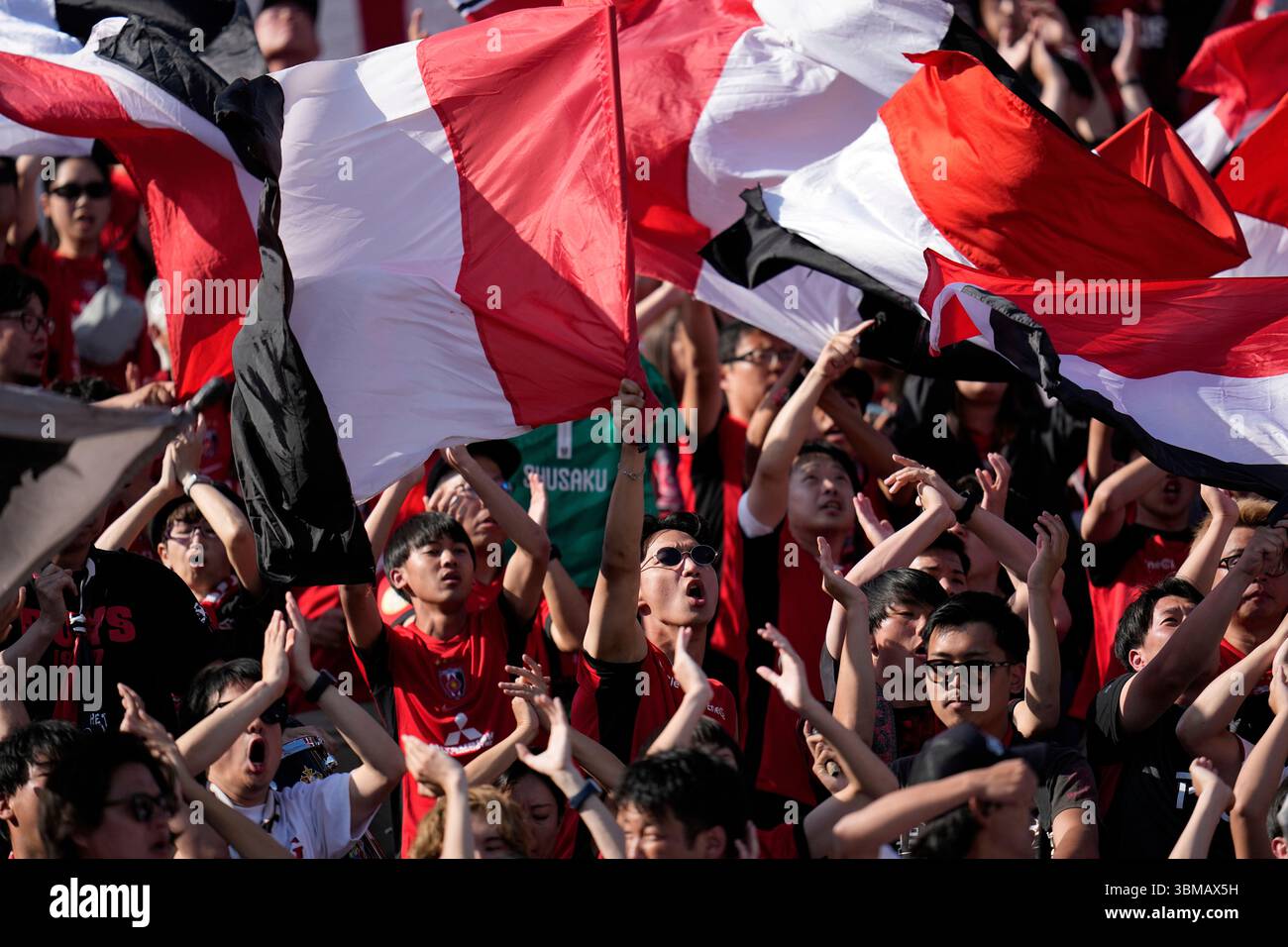 Fans cheer before the Club World Cup Group E soccer match between Urawa ...