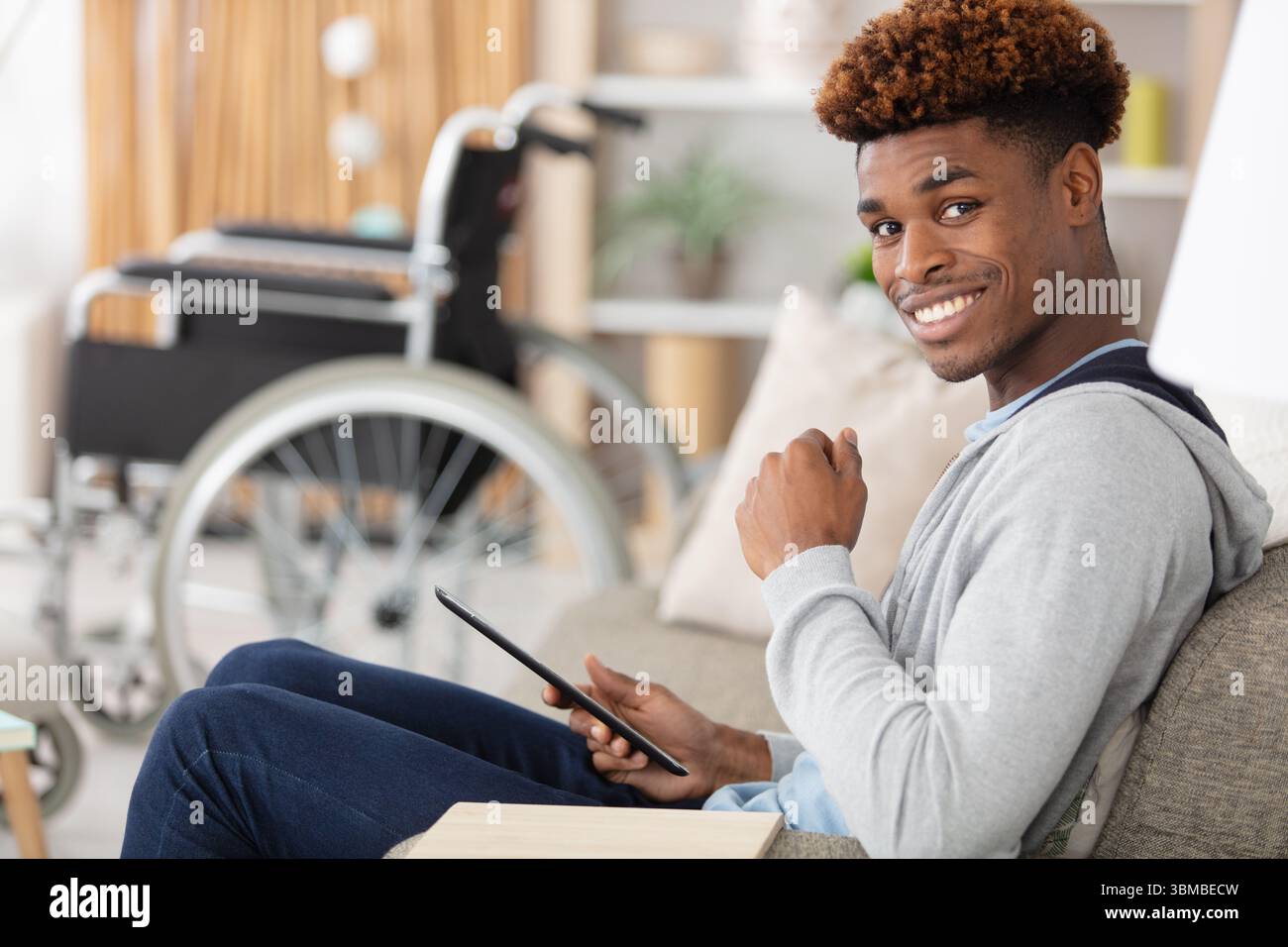 dsabled man using digital tablet Stock Photo