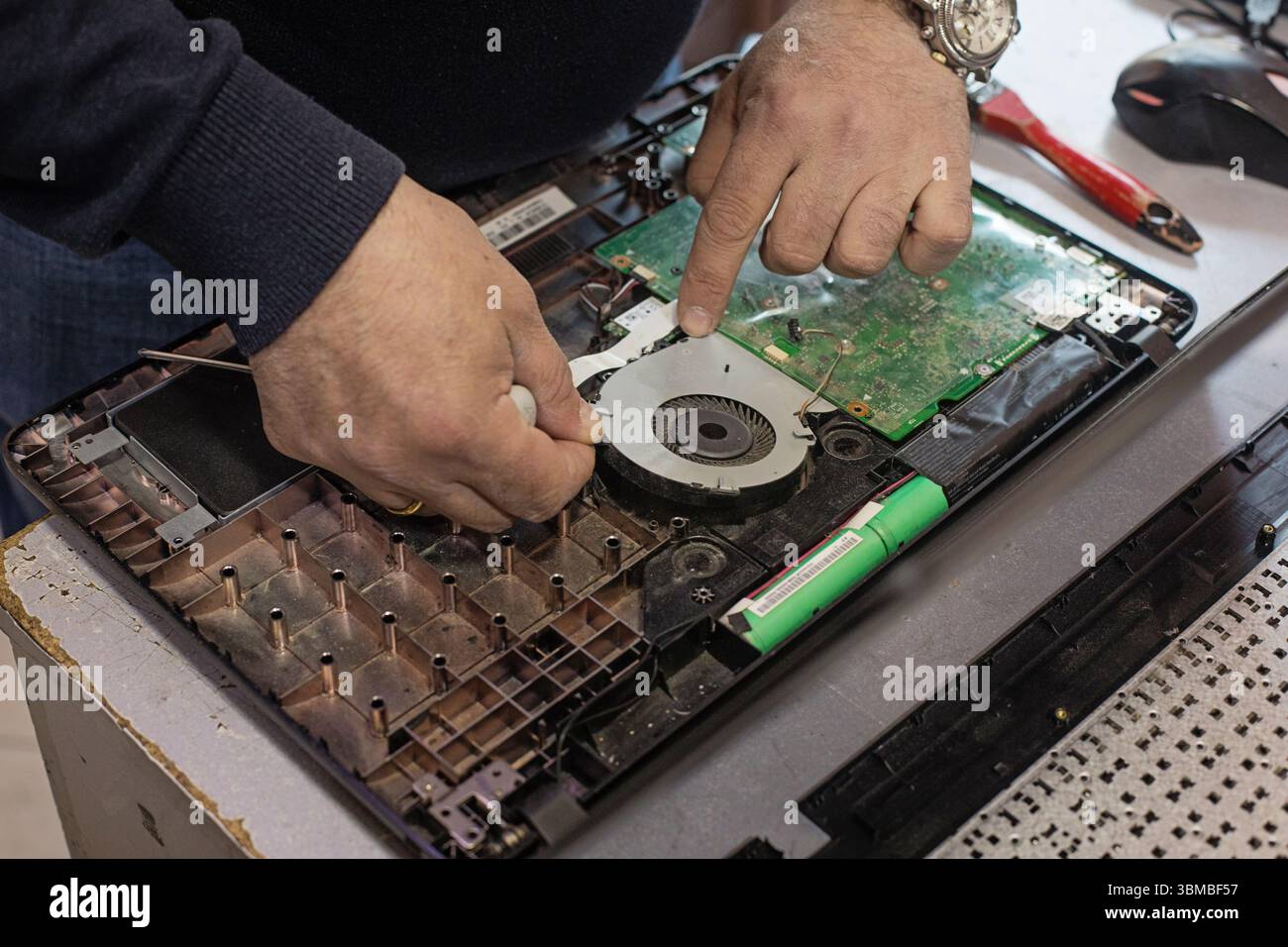Technician repairing laptop computer closeup Stock Photo