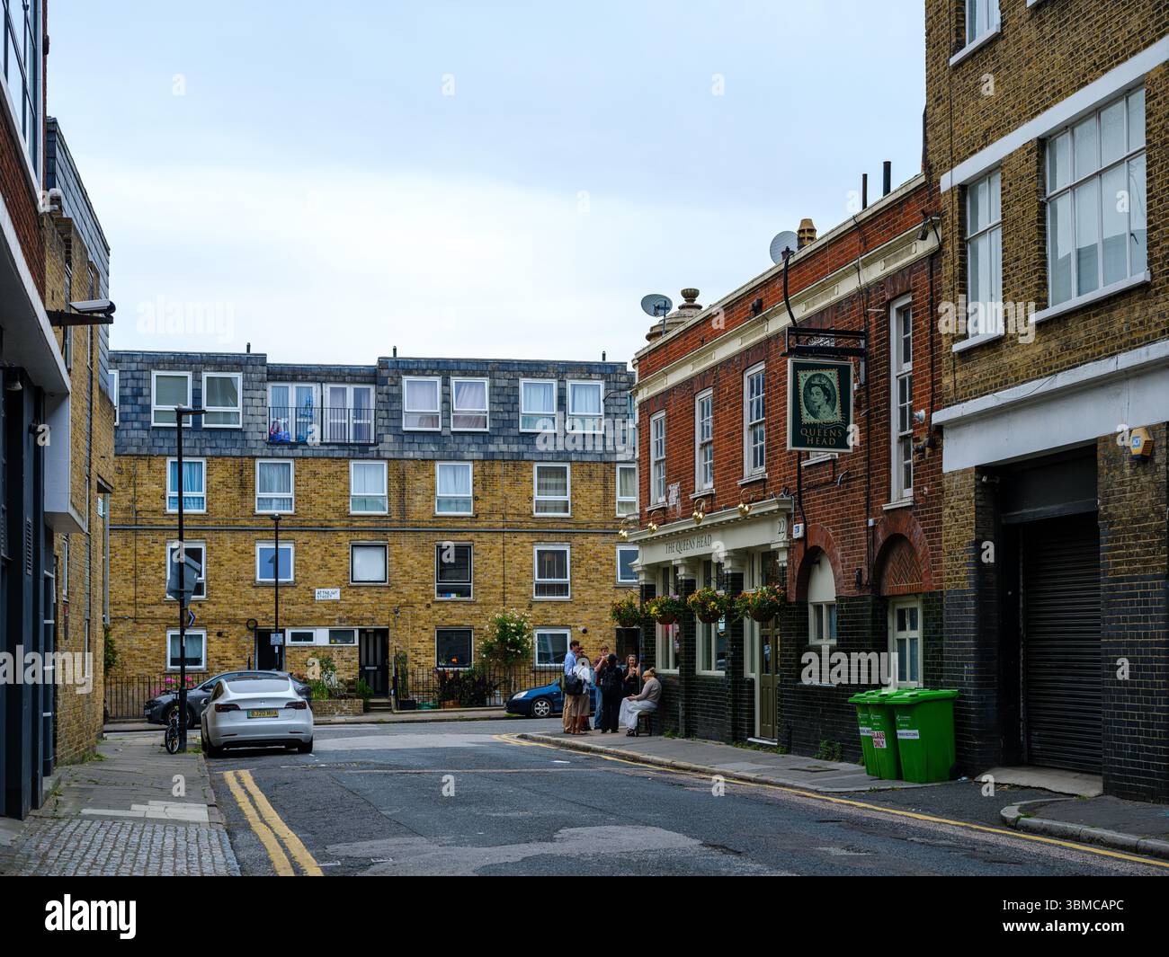 United Kingdom, London, 23 Jun 2025. Quiet residential mews with brick terraced houses and parked cars in East London. Stock Photo