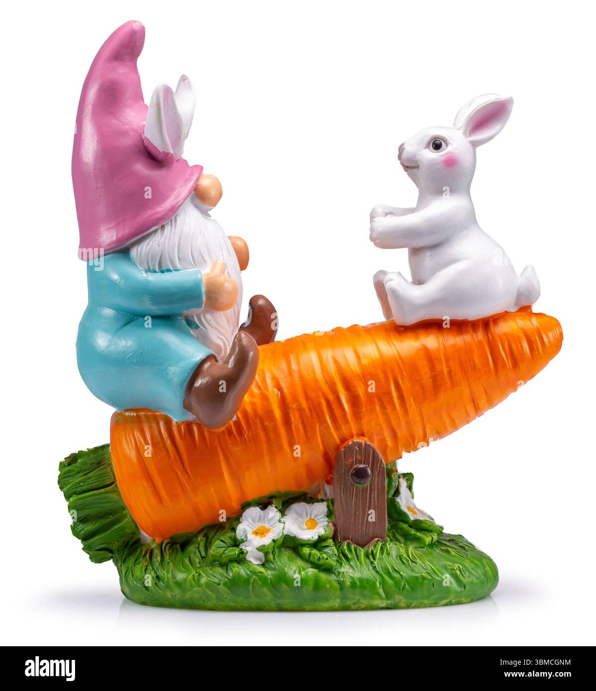 Easter ceramic statue with garden gnome and rabbit on a big carrot ...