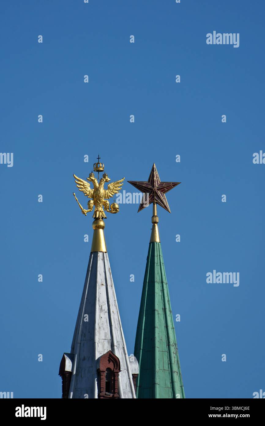 A golden eagle on a silver spire and a Soviet ruby star on a green ...