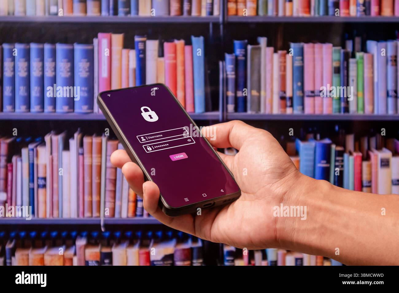 Hand holding a smartphone to login username and password on screen. Data privacy online protection on mobile phone application. Stock Photo