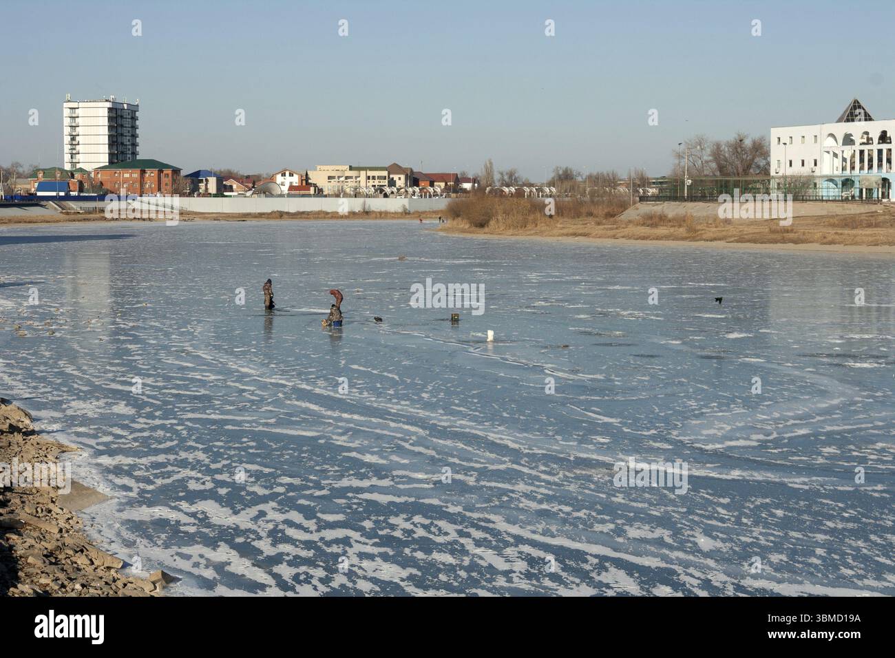 Fishermen catch fish on the river, winter fishing Stock Photo