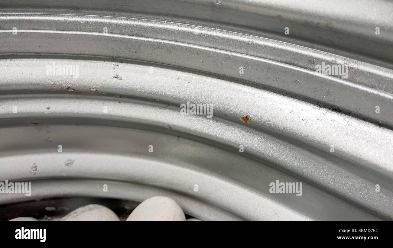 Rust spots on galvanized basement window well Stock Photo