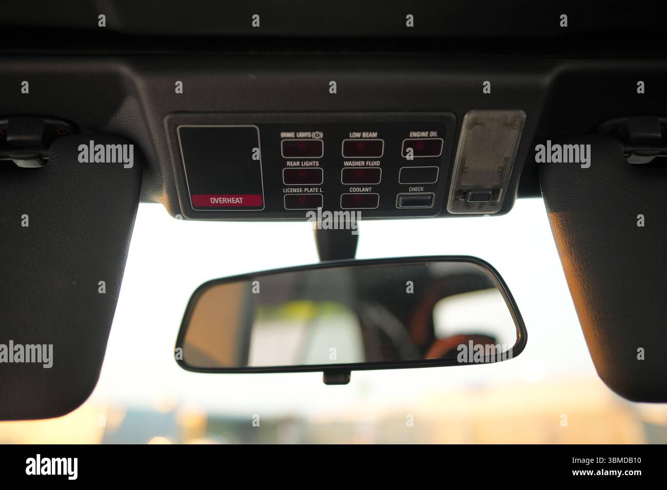 A closeup image of a BMW e30 overhead control panel along with the ...