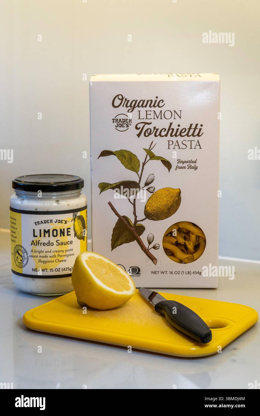 Still life of Trader Joe's Limone Alfredo sauce and complementary lemon torchietti dried pasta, 2025, USA Stock Photo